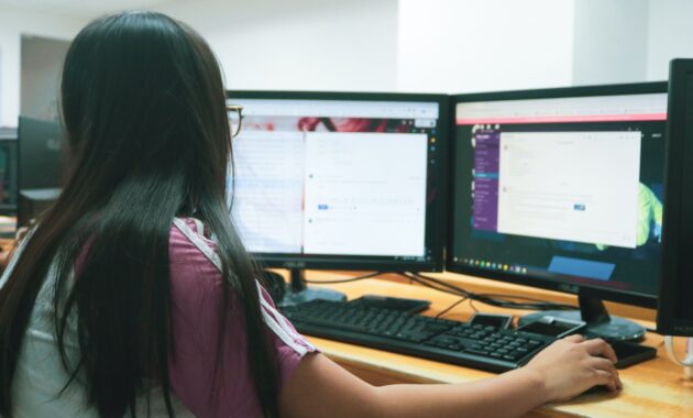 woman using desktop computer