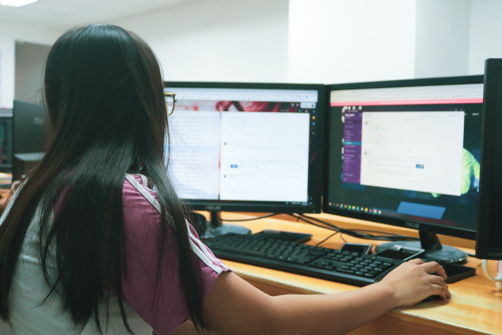woman using desktop computer