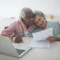 A Happy Elderly Couple Holding a Document